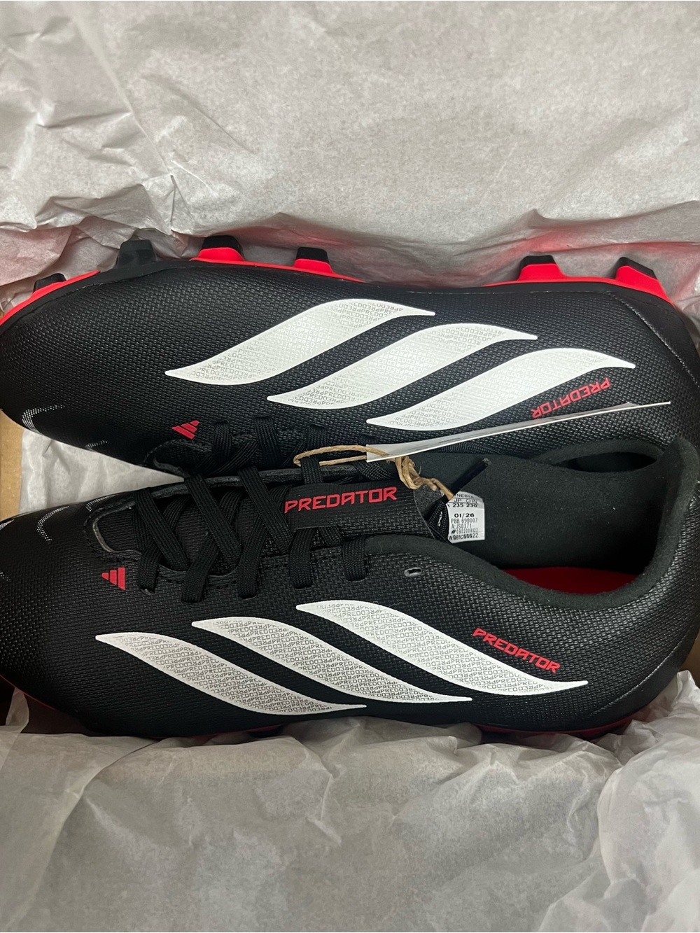 adidas Black Soccer Cleats with White Stripes and Red Accents